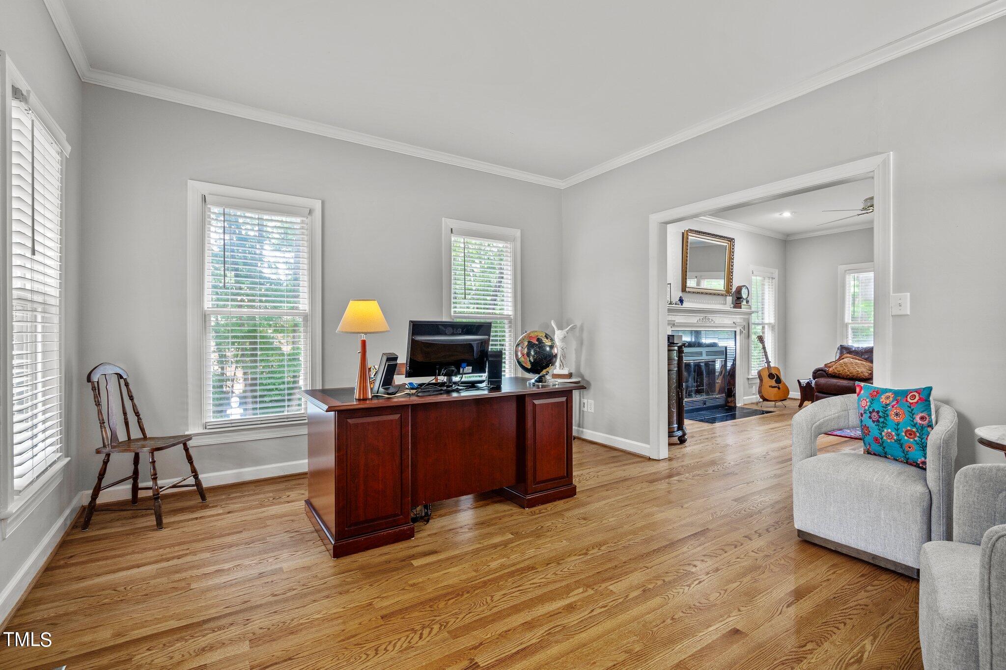 100 Shepton Drive Cary, NC 27519 - Photo 8 of 43 a living room with furniture and a wooden floor