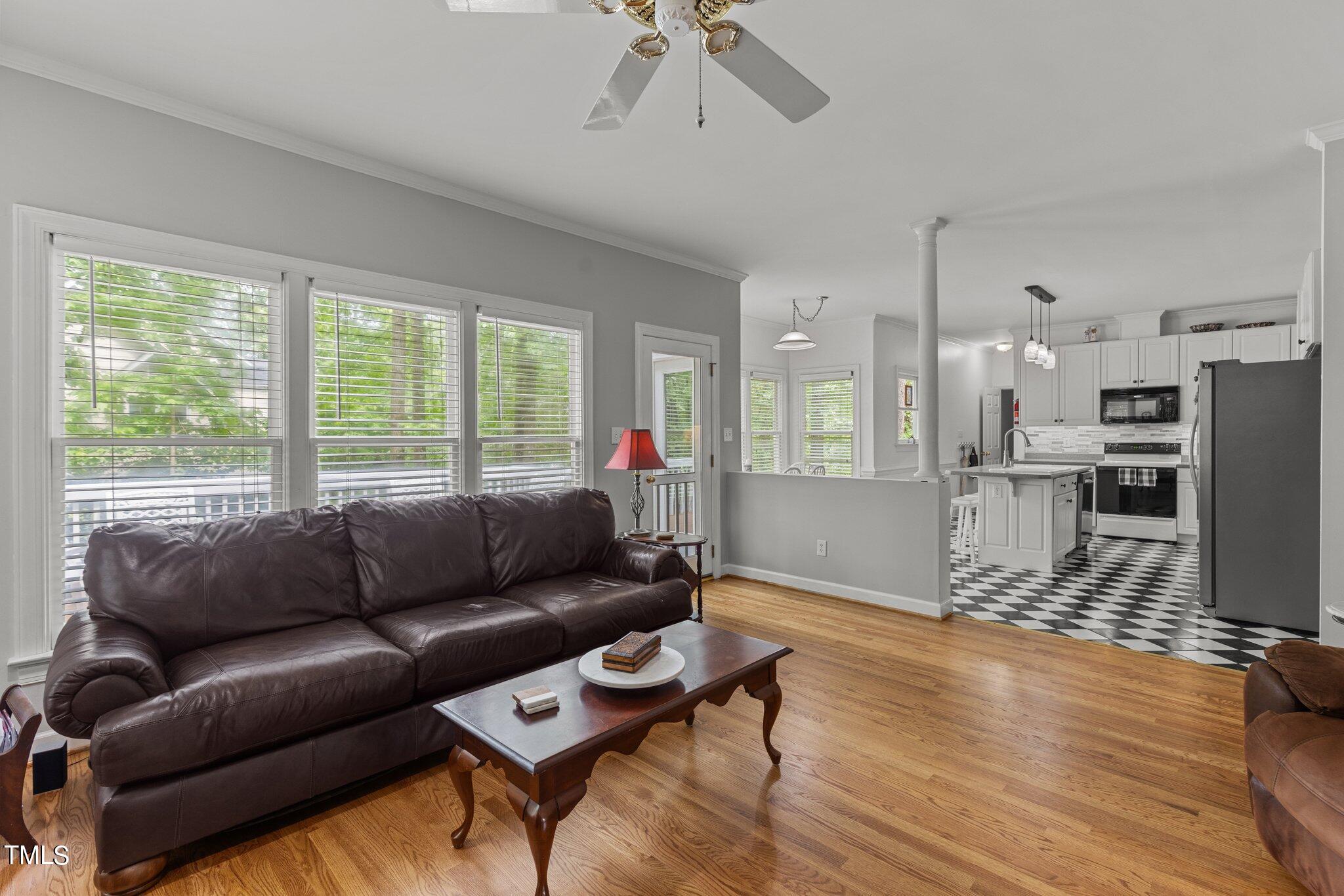100 Shepton Drive Cary, NC 27519 - Photo 9 of 43 a living room with furniture and a wooden floor