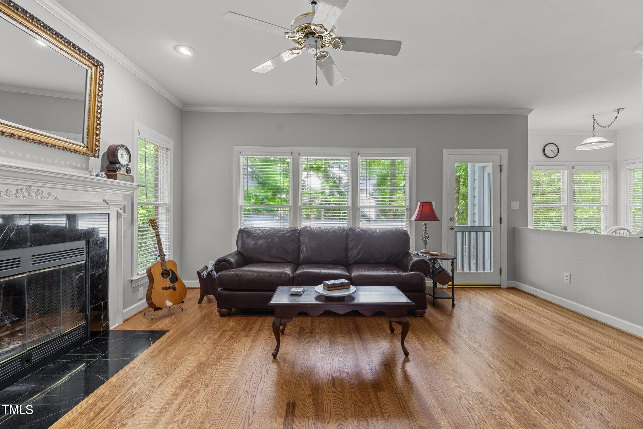 100 Shepton Drive Cary, NC 27519 - Photo 10 of 43 a living room with furniture and a fireplace