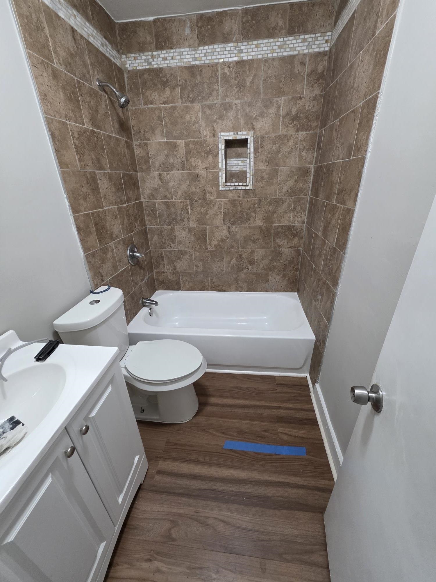 1319 Nicholas Street Memphis, TN 38107 - Photo 14 of 14 a bathroom with a toilet and a shower