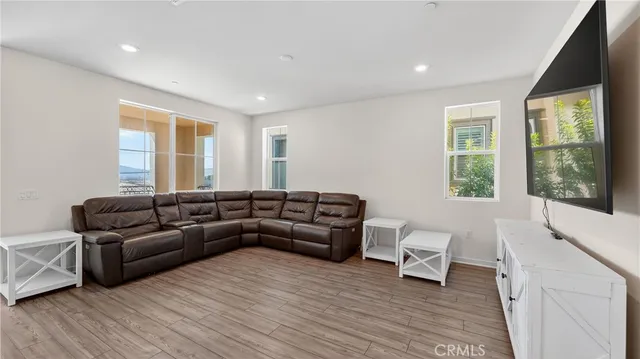 a living room with furniture and a large window