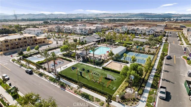 an aerial view of multiple houses with yard