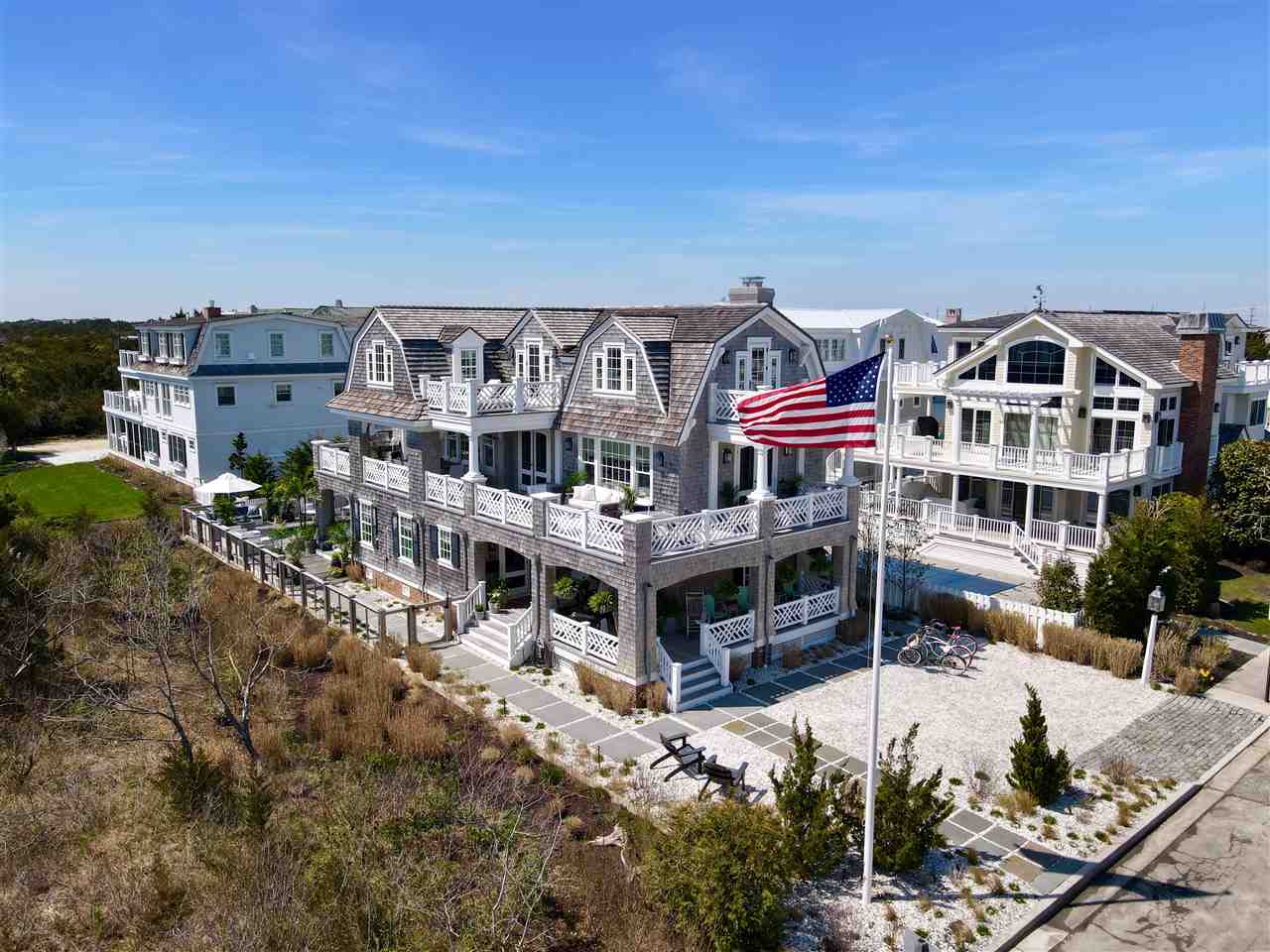 74 38th Street Avalon, NJ 08202 - Photo 2 of 39 a front view of a house with a yard