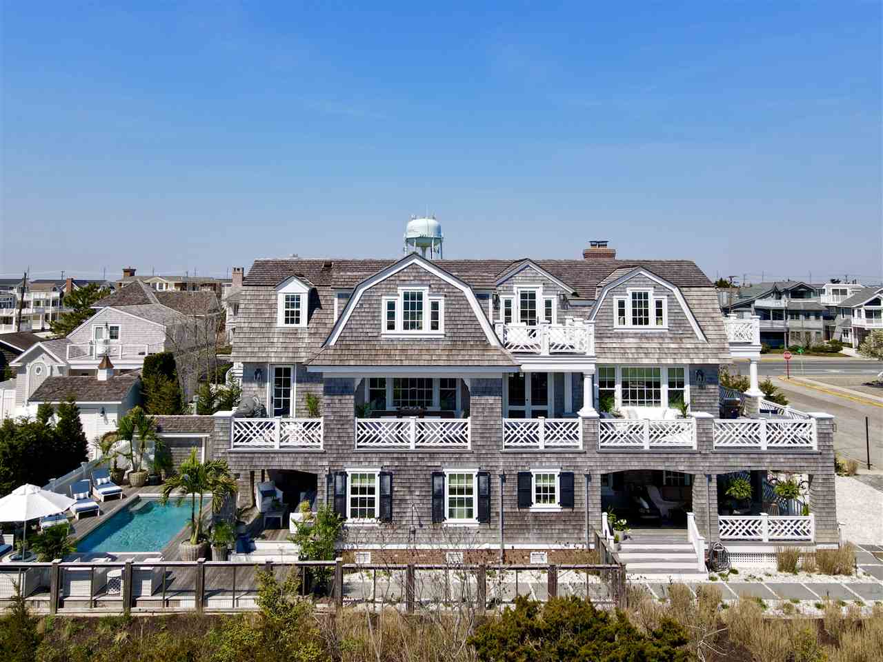 74 38th Street Avalon, NJ 08202 - Photo 3 of 39 a front view of a building with street view
