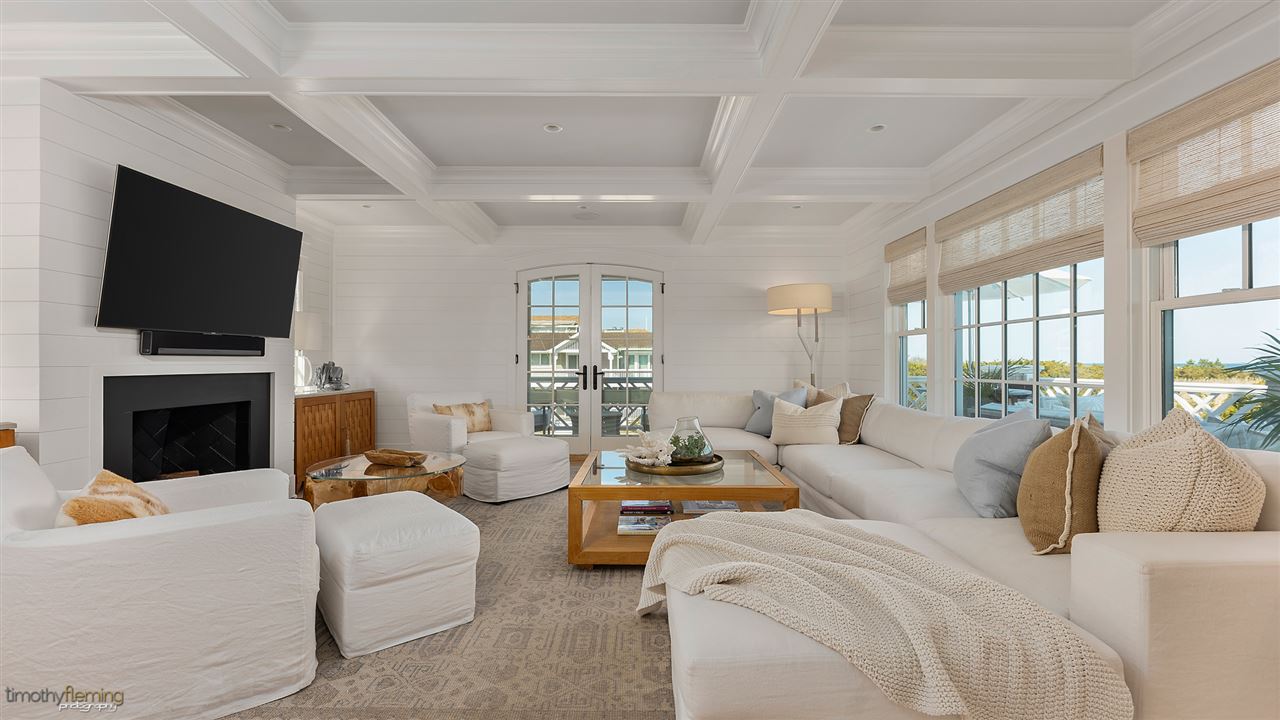 74 38th Street Avalon, NJ 08202 - Photo 21 of 39 a living room with furniture a fireplace and a flat screen tv