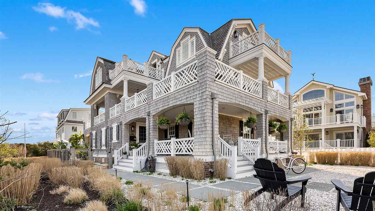 74 38th Street Avalon, NJ 08202 - Photo 4 of 39 a front view of a house with parking space