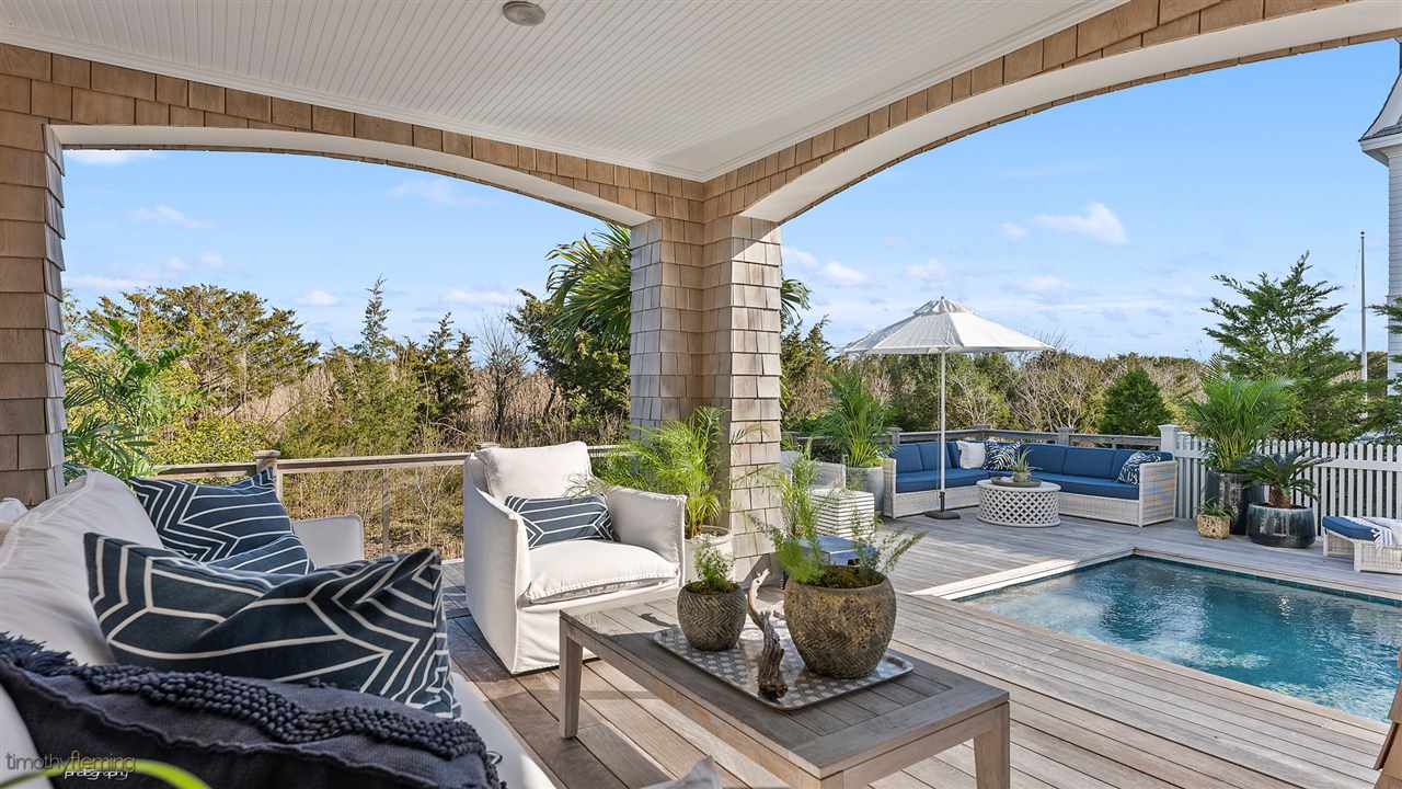 74 38th Street Avalon, NJ 08202 - Photo 37 of 39 a view of a balcony with lake view and a potted plant
