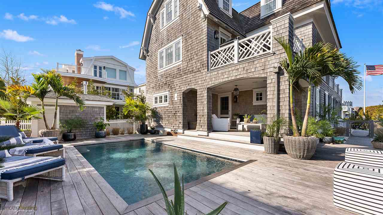 74 38th Street Avalon, NJ 08202 - Photo 39 of 39 a view of a house with backyard and sitting area