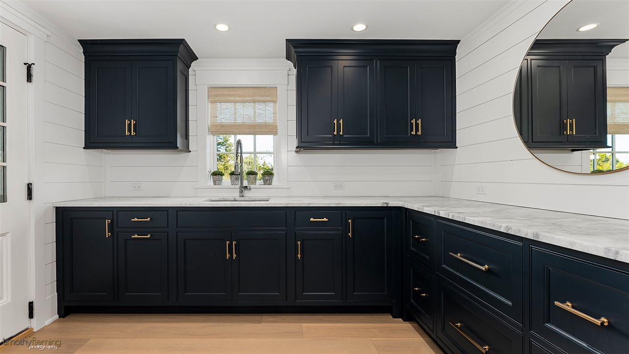 74 38th Street Avalon, NJ 08202 - Photo 7 of 39 a bathroom with a sink and a mirror