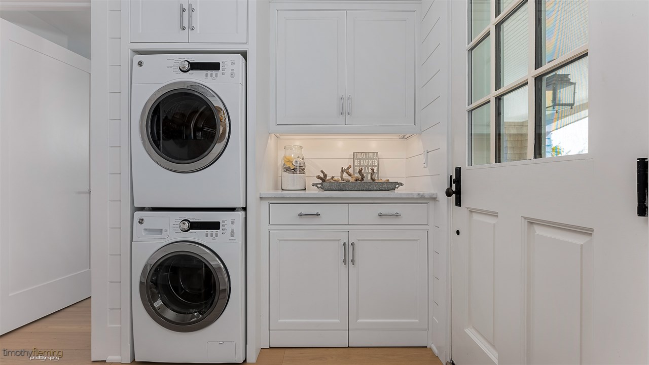 74 38th Street Avalon, NJ 08202 - Photo 10 of 39 a utility room with sink dryer and washer