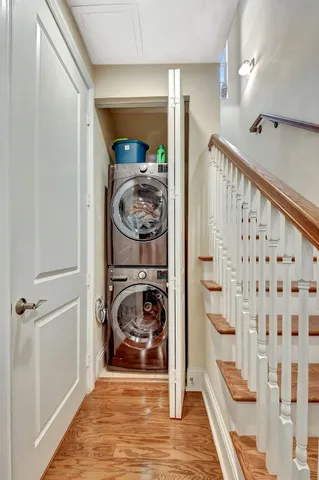 a view of a dining room with furniture wooden floor and chandelier