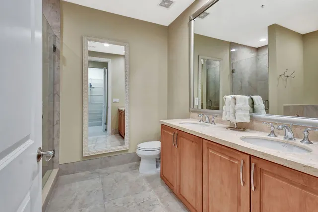 a view of a patio with a table and chairs under an umbrella