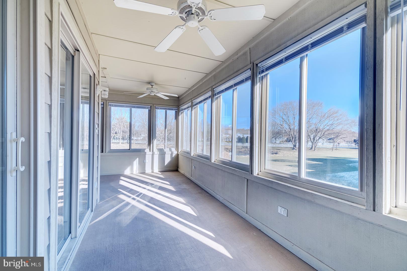 18484 Drayton Hall Road, Unit 8 Lewes, DE 19958 - Photo 6 of 28 Sunroom - so much warmth!