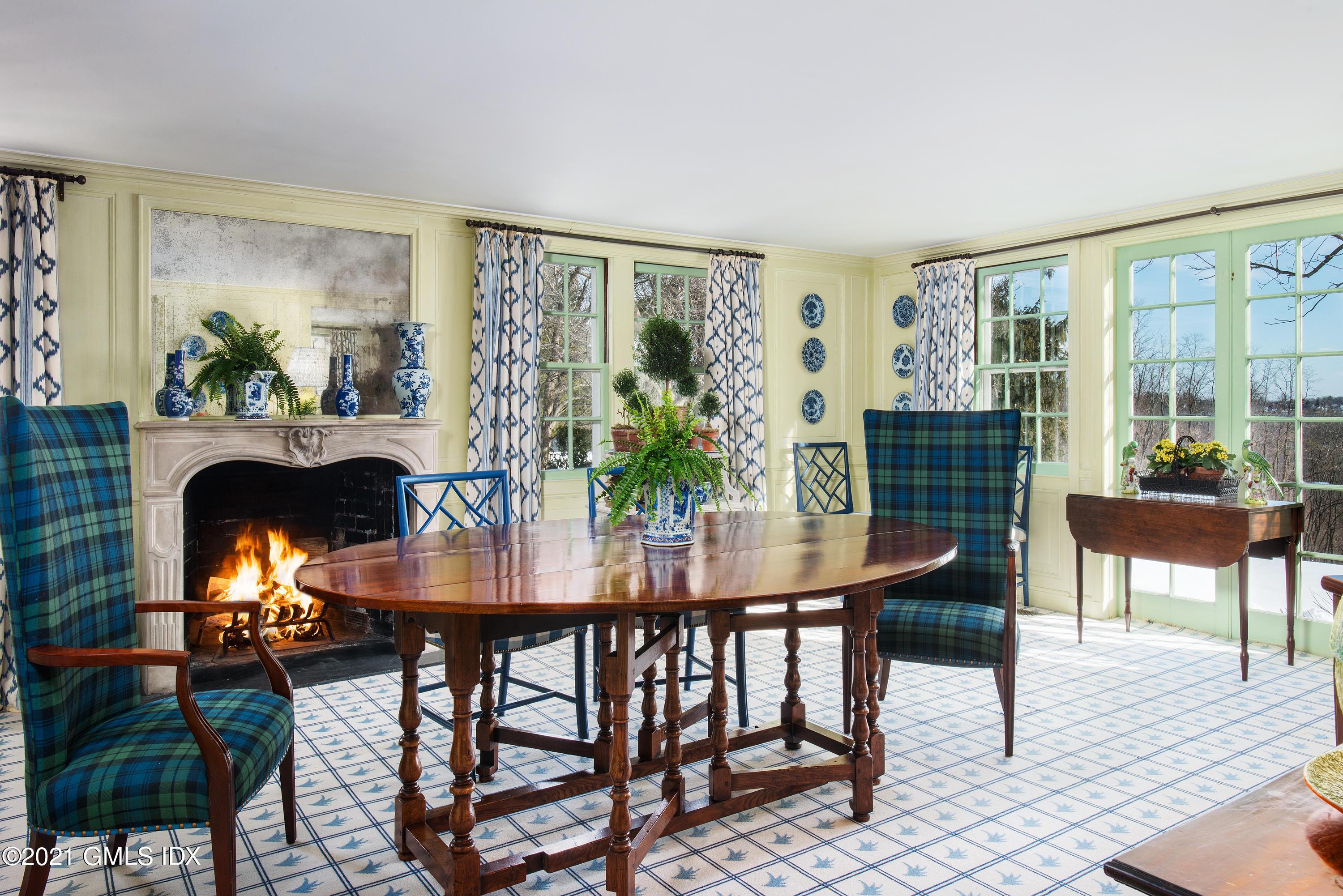 591 Riversville Road Greenwich, CT 06831 - Photo 16 of 79 a view of a dining room with furniture window and wooden floor