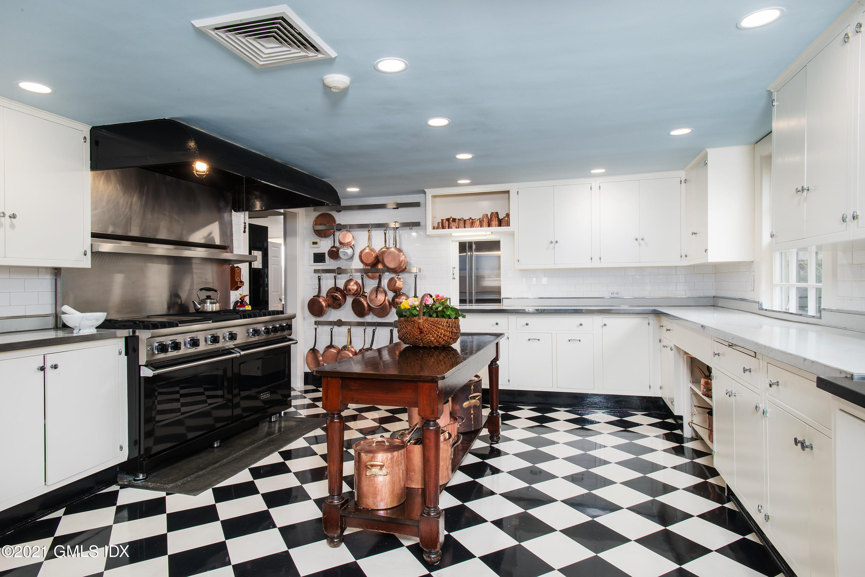 591 Riversville Road Greenwich, CT 06831 - Photo 18 of 79 a kitchen with granite countertop stainless steel appliances a sink and cabinets