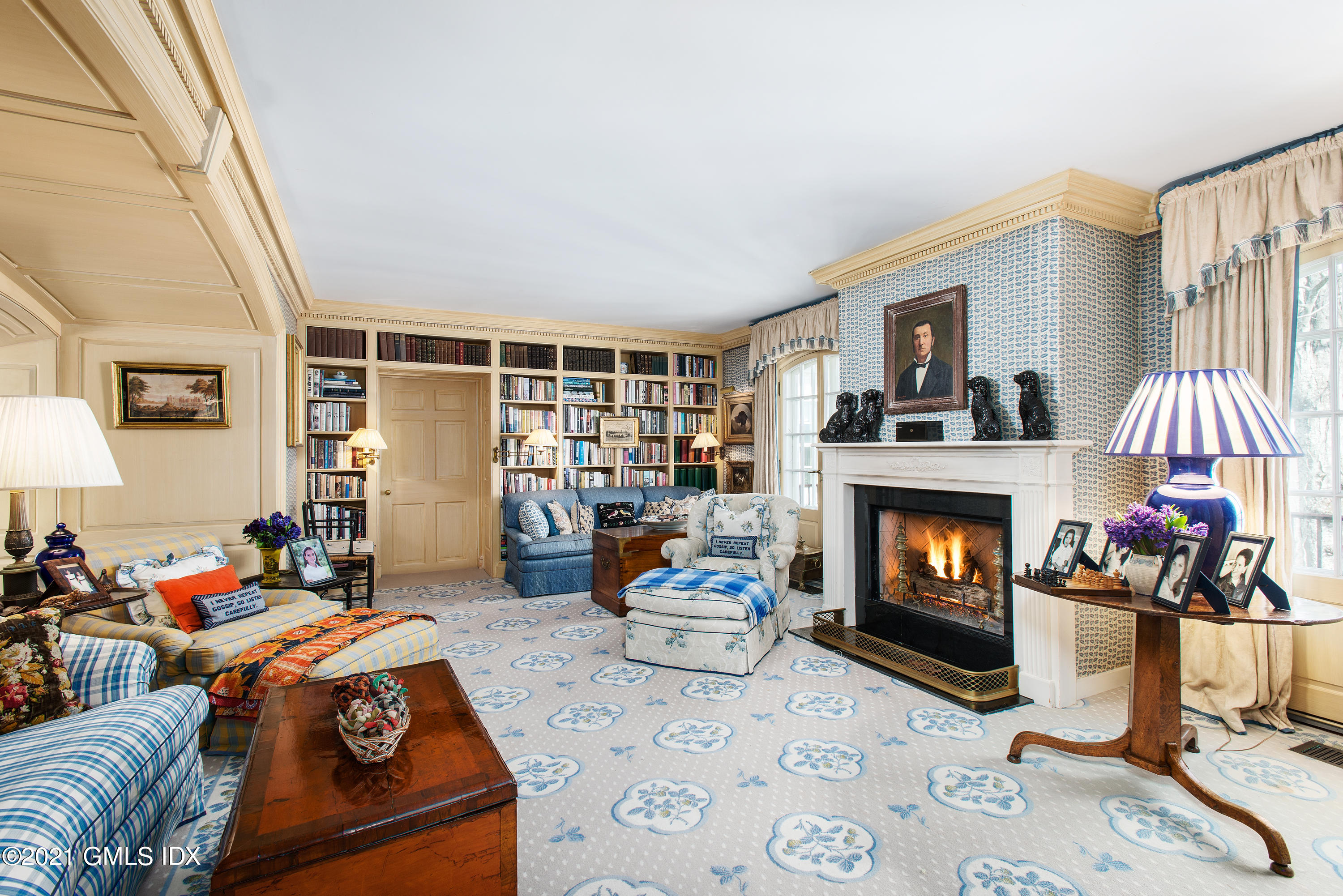 591 Riversville Road Greenwich, CT 06831 - Photo 20 of 79 a living room with furniture a fireplace and a flat screen tv