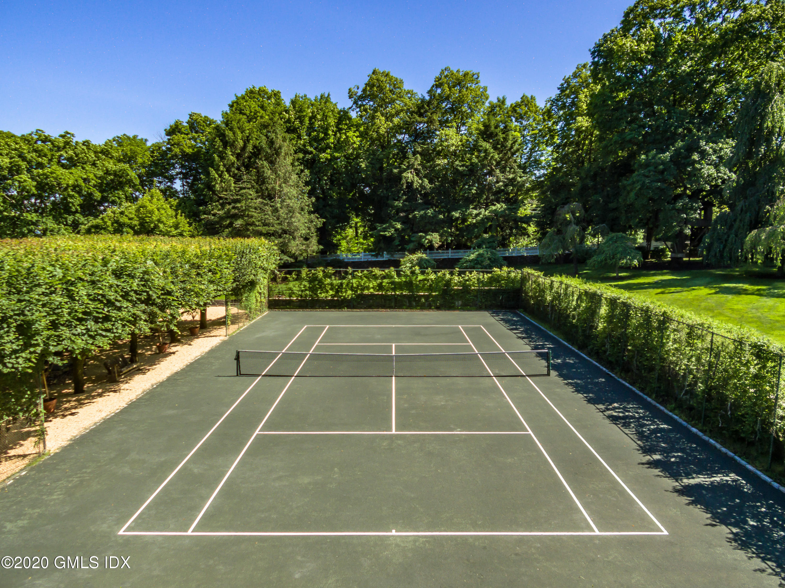 591 Riversville Road Greenwich, CT 06831 - Photo 46 of 79 a view of a tennis court