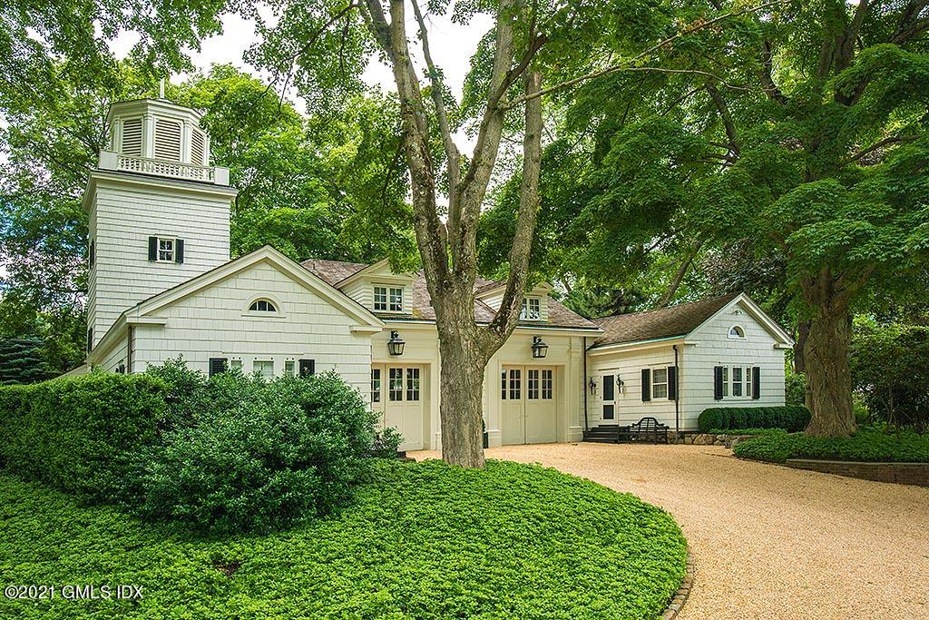 591 Riversville Road Greenwich, CT 06831 - Photo 76 of 79 a view of house with a yard and potted plants