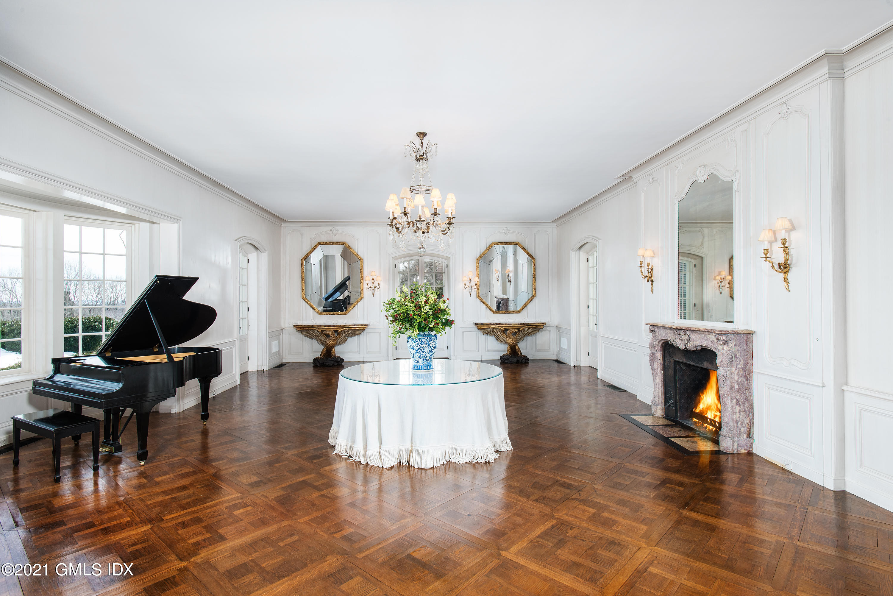 591 Riversville Road Greenwich, CT 06831 - Photo 9 of 79 a living room with fireplace furniture and a chandelier