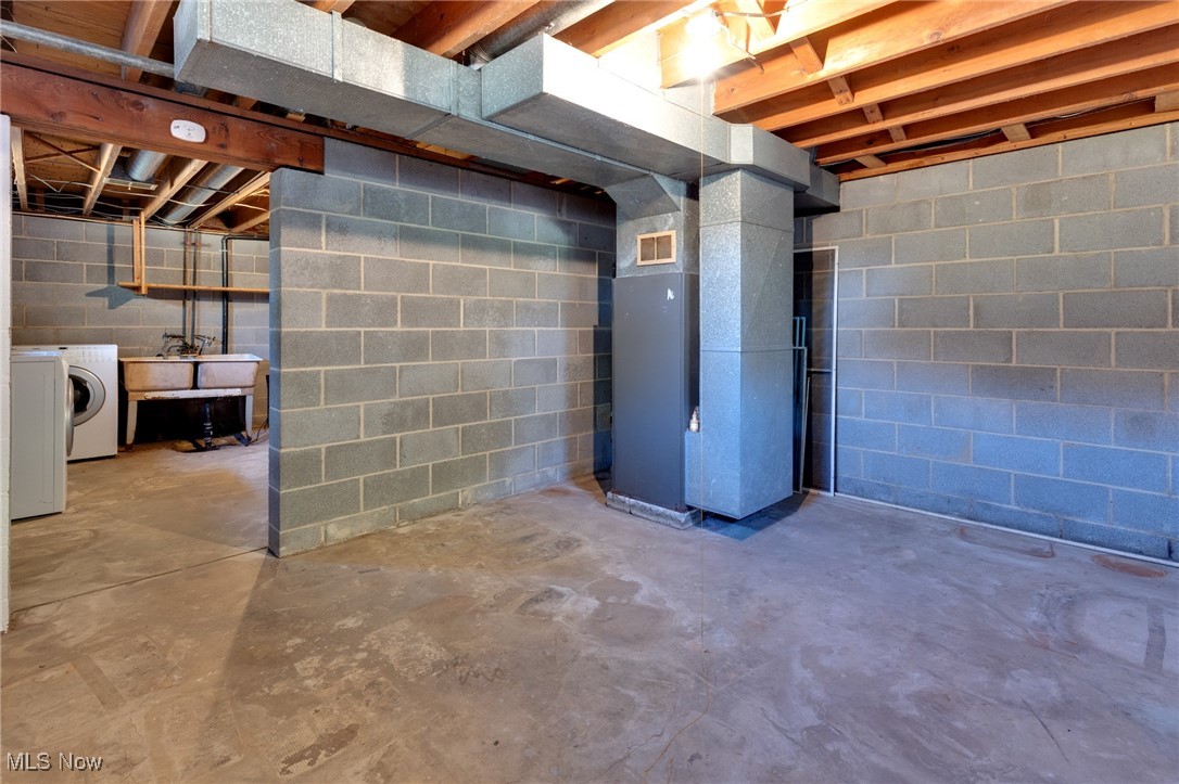 3433 Greenwich Road Barberton, OH 44203 - Photo 27 of 41 This is the mechanicals room, with the hot water tank (replaced in 2019) tucked behind the furnace.