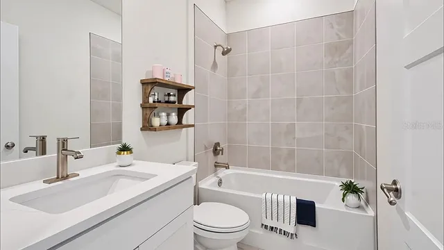 a bathroom with a sink a toilet and a bathtub