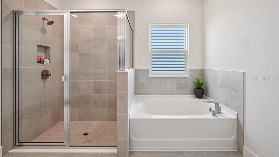 11275 Duckling Way Weeki Wachee, FL 34613 - Photo 7 of 14 a bathroom with a bathtub and a shower