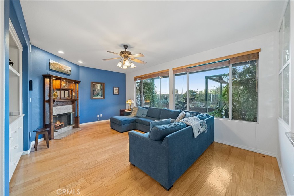 31782 Via San Carlos Temecula, CA 92592 - Photo 21 of 69 a living room with furniture and a flat screen tv