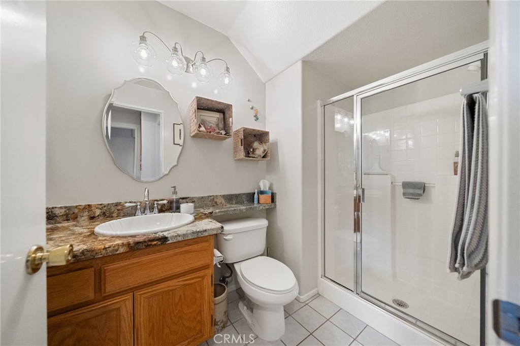 31782 Via San Carlos Temecula, CA 92592 - Photo 25 of 69 a bathroom with a toilet sink and shower