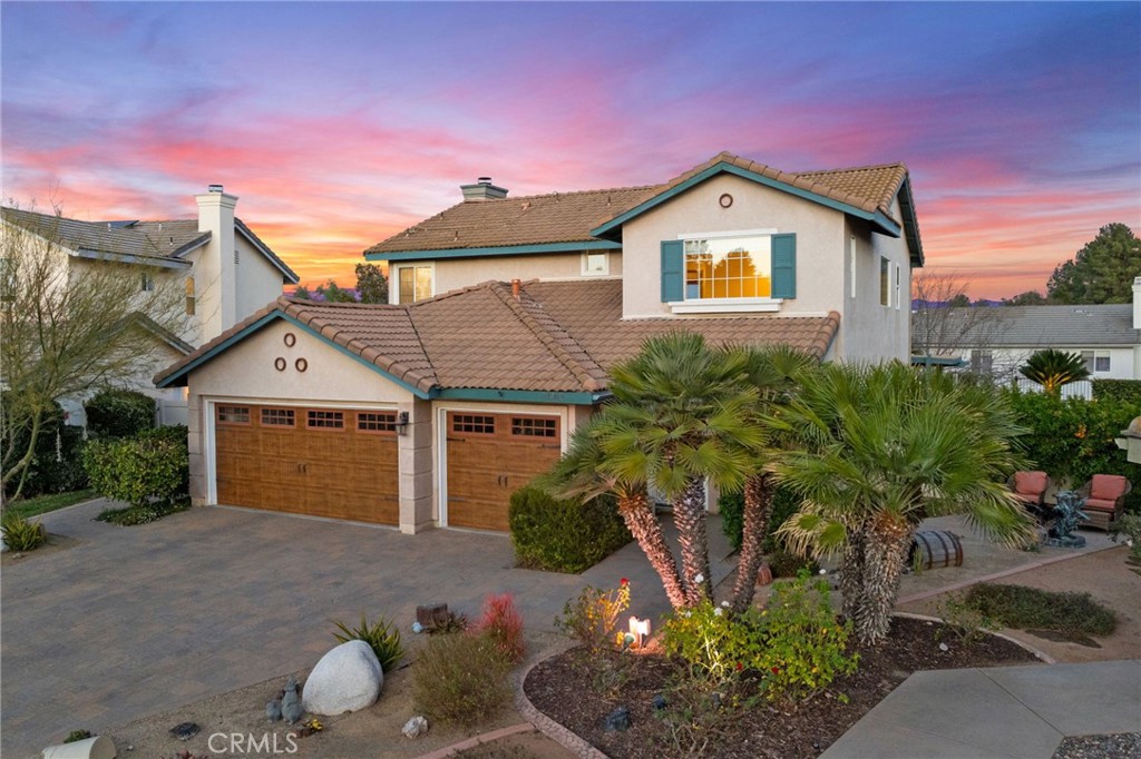 31782 Via San Carlos Temecula, CA 92592 - Photo 4 of 69 a front view of a house with a yard and garage