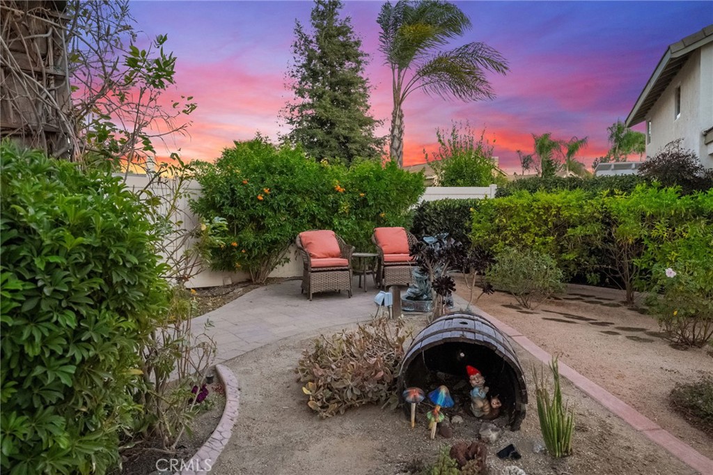 31782 Via San Carlos Temecula, CA 92592 - Photo 10 of 69 a view of a chair and table in the backyard