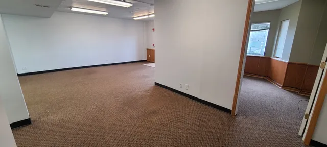 a view of an empty room and window
