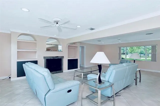 a kitchen with stainless steel appliances a sink dishwasher stove refrigerator and cabinets