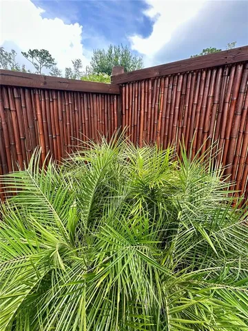 a front view of a house with garden and porch