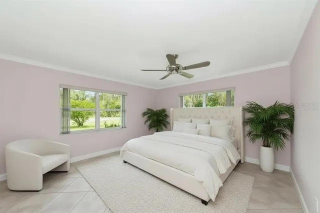 a bedroom with a large bed and a couch