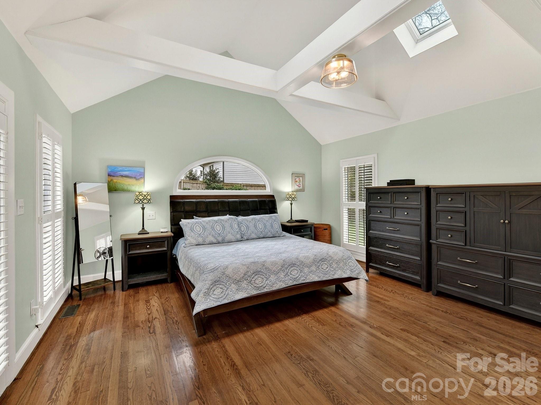 1535 Providence Road Charlotte, NC 28207 - Photo 12 of 42 a bedroom with a bed and wooden floor