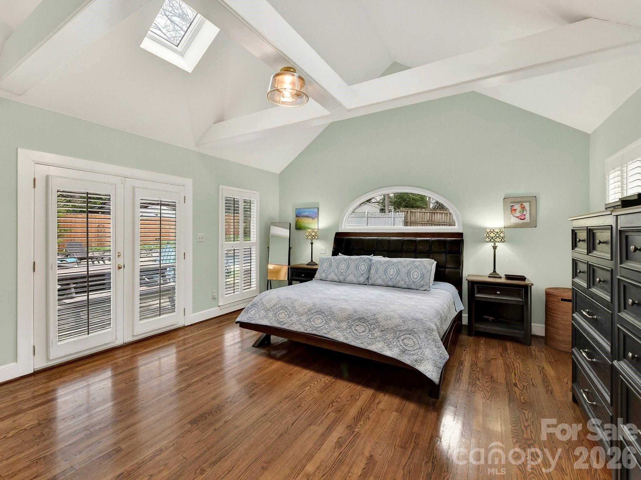 1535 Providence Road Charlotte, NC 28207 - Photo 13 of 42 a spacious bedroom with a bed and wooden floor