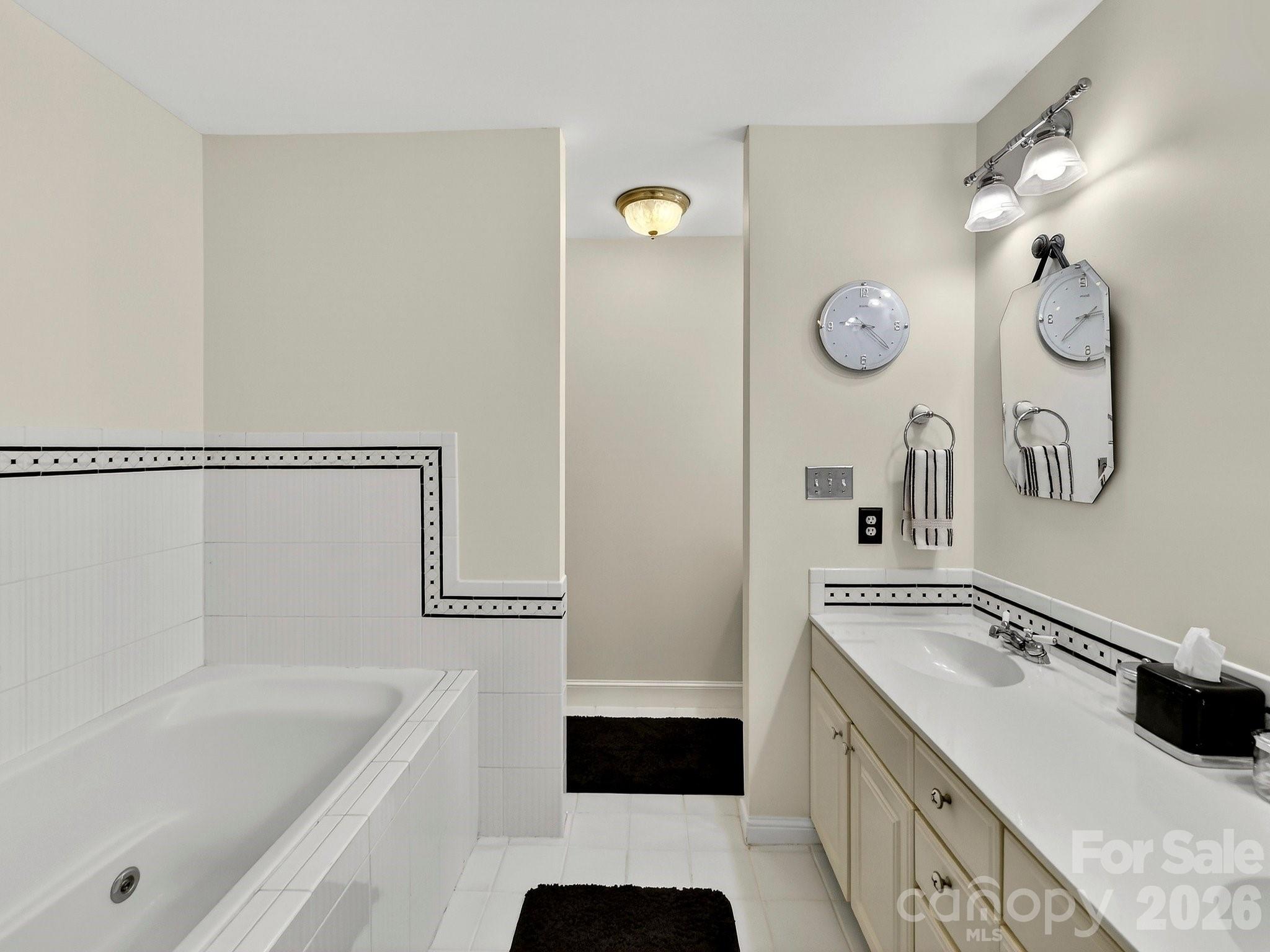 1535 Providence Road Charlotte, NC 28207 - Photo 14 of 42 a bathroom with a tub sink and mirror