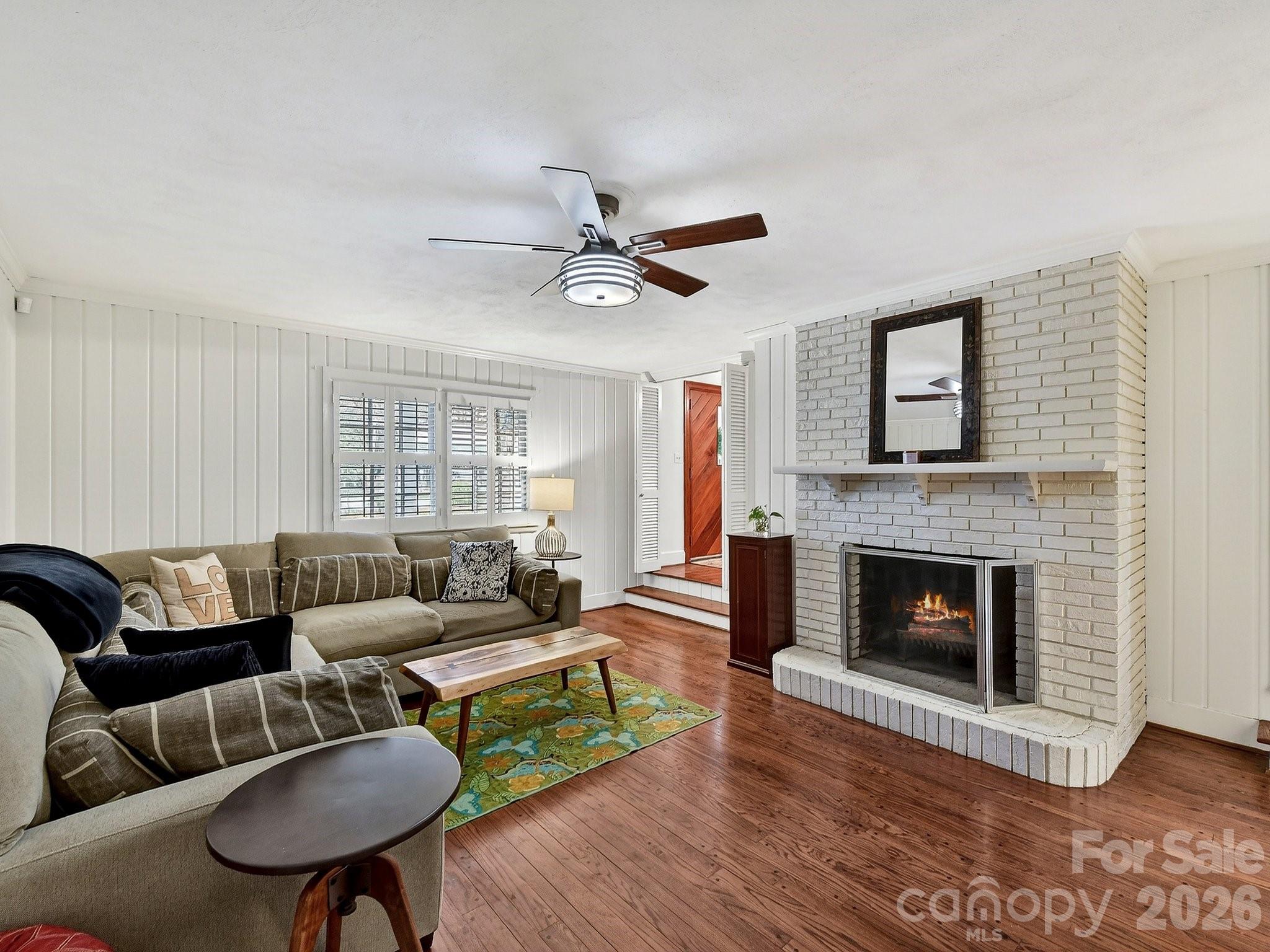1535 Providence Road Charlotte, NC 28207 - Photo 17 of 42 a living room with furniture and a fireplace