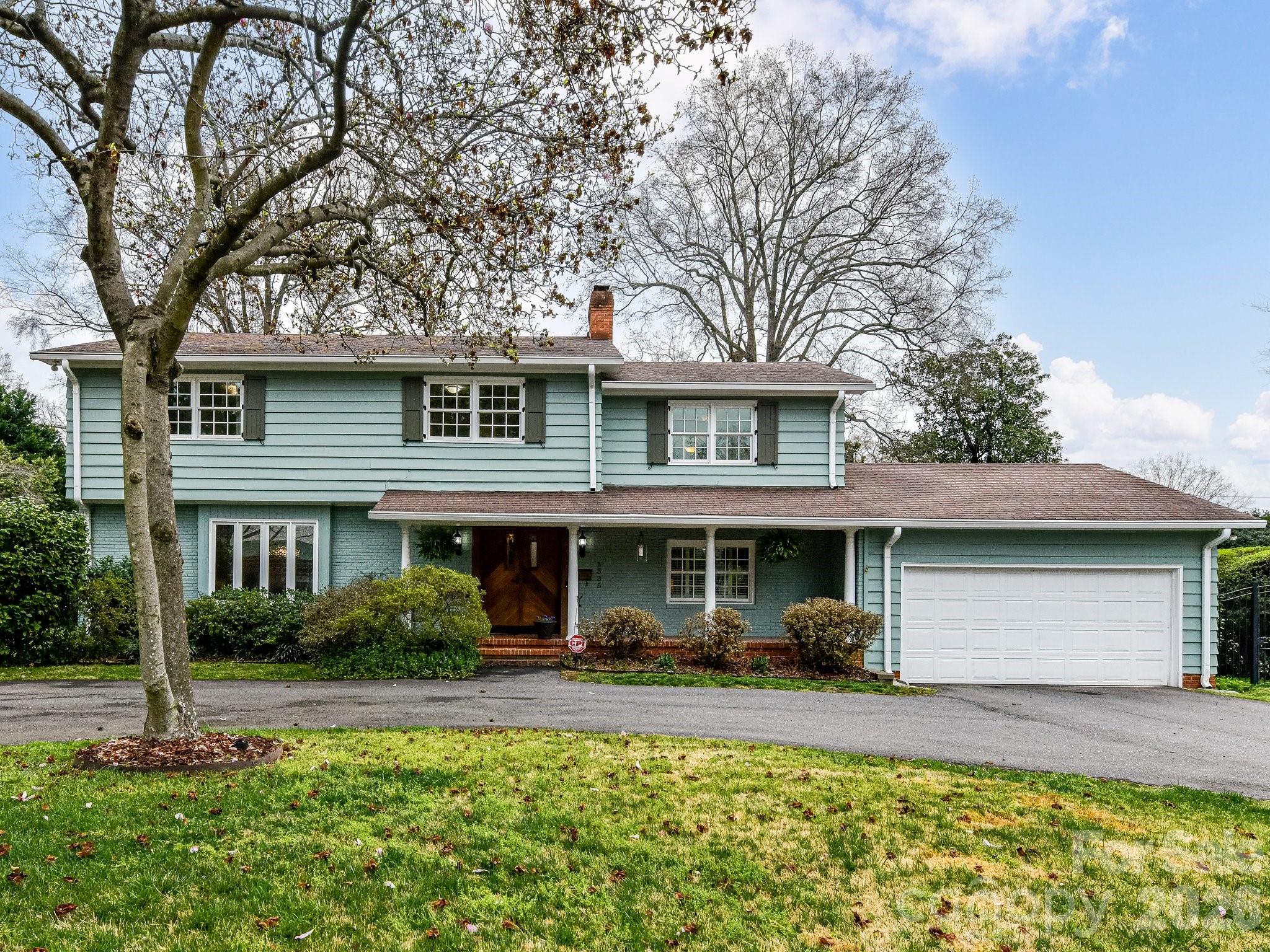 1535 Providence Road Charlotte, NC 28207 - Photo 2 of 42 a front view of a house with garden