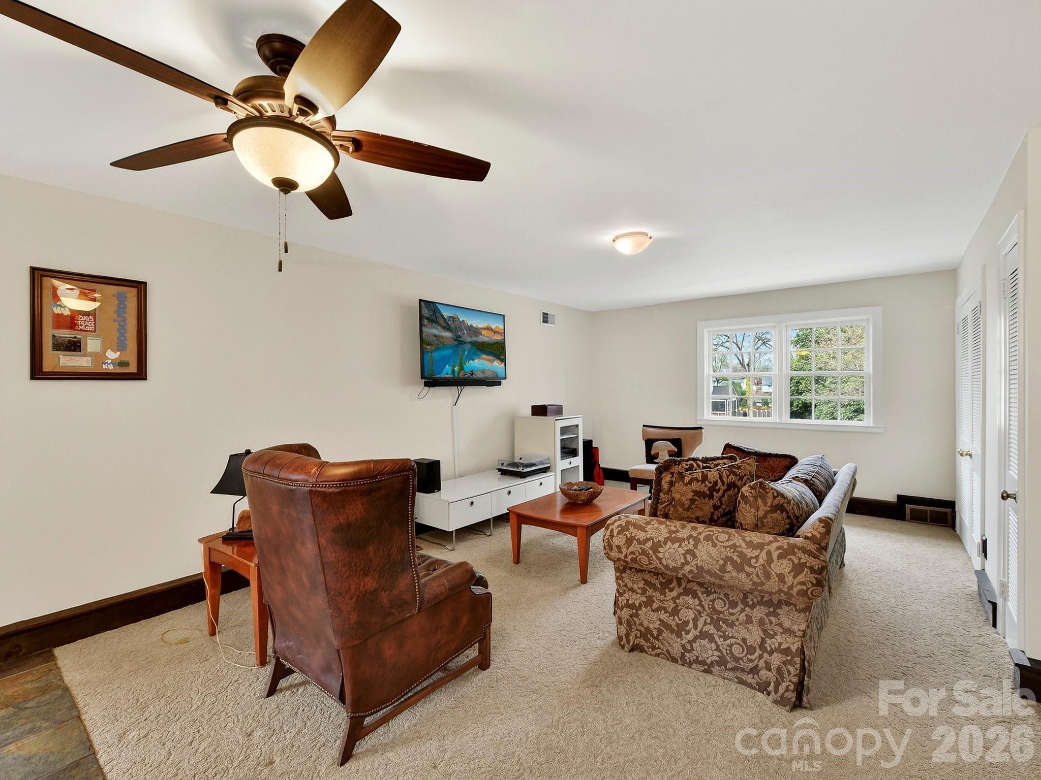 1535 Providence Road Charlotte, NC 28207 - Photo 25 of 42 a living room with furniture and a window