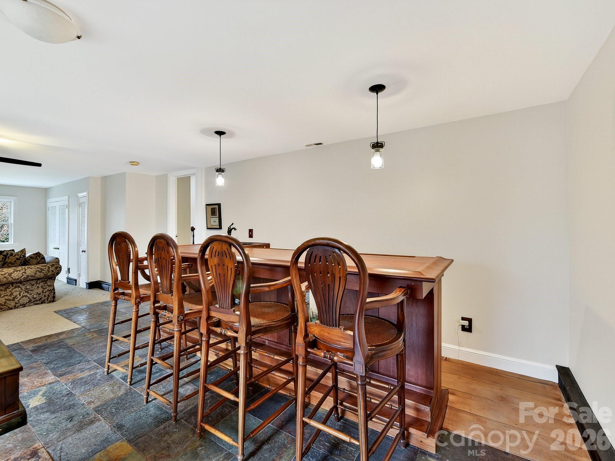 1535 Providence Road Charlotte, NC 28207 - Photo 26 of 42 a dinning room with furniture and a chandelier