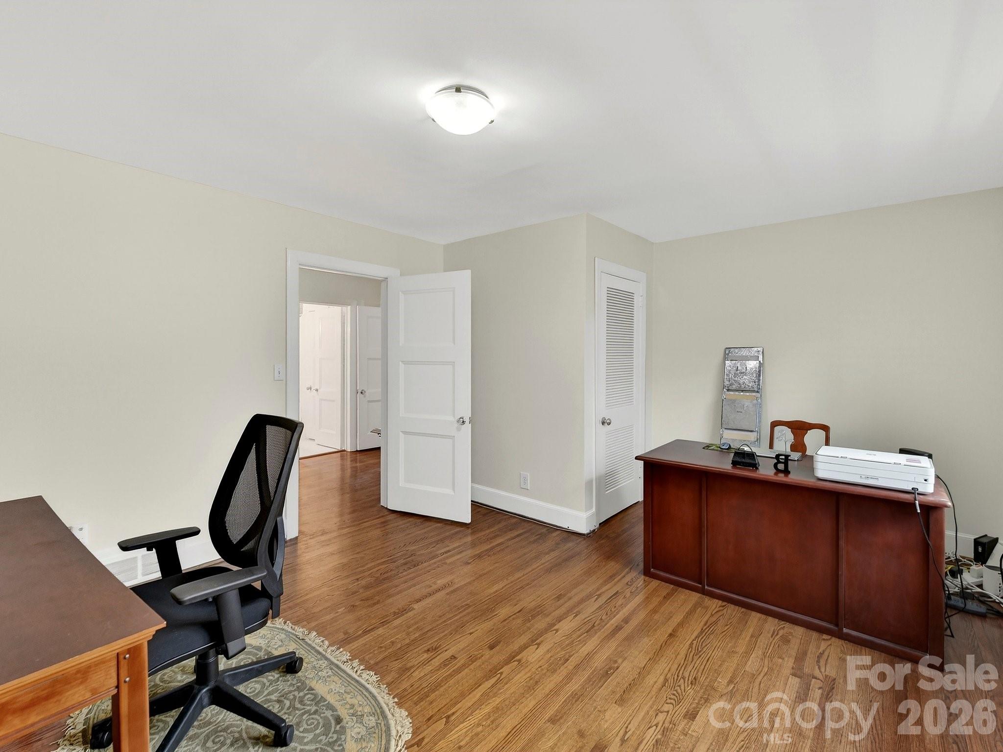 1535 Providence Road Charlotte, NC 28207 - Photo 29 of 42 a workspace with furniture and wooden floor