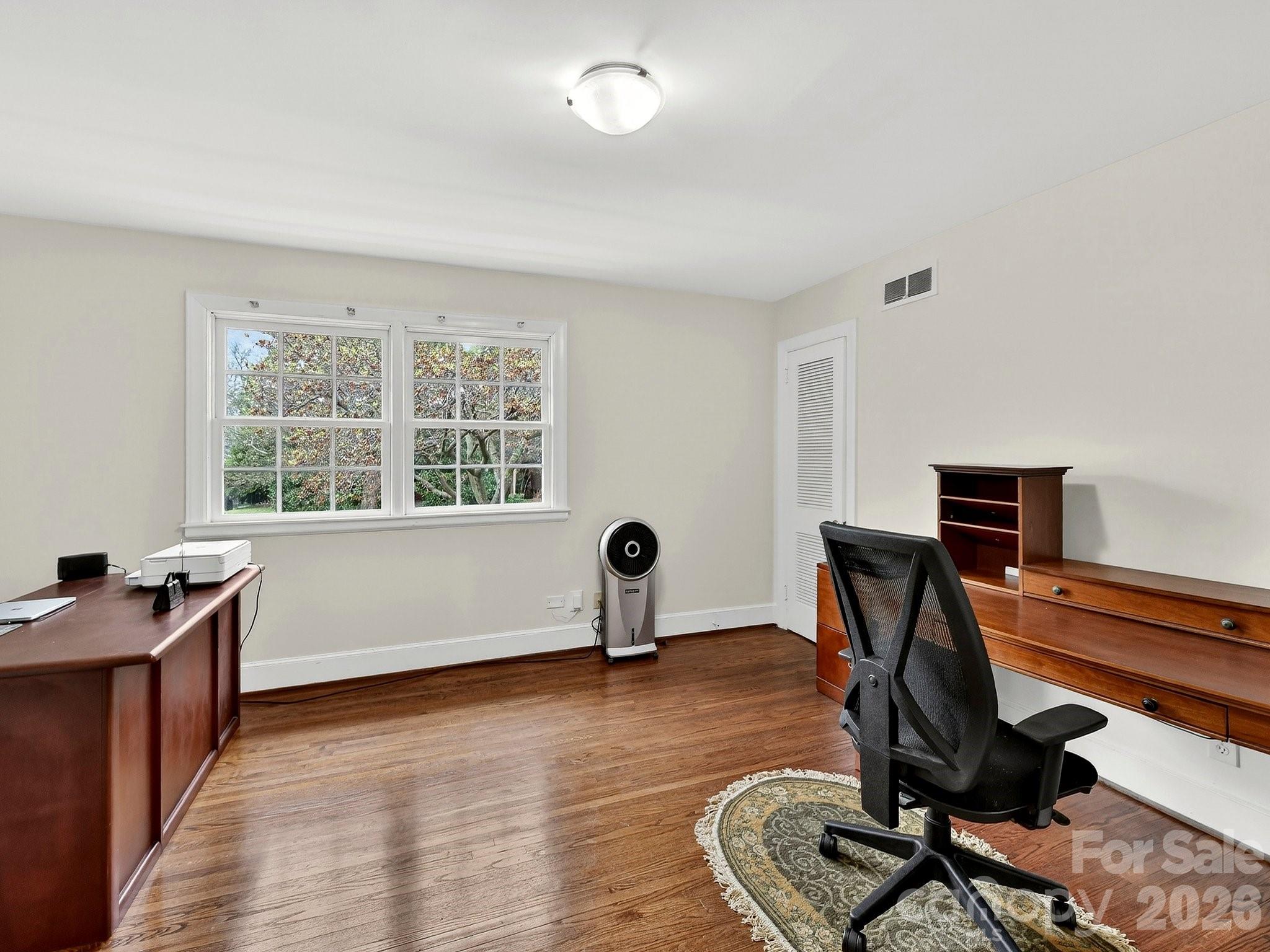 1535 Providence Road Charlotte, NC 28207 - Photo 30 of 42 a view of a workspace with furniture and a window