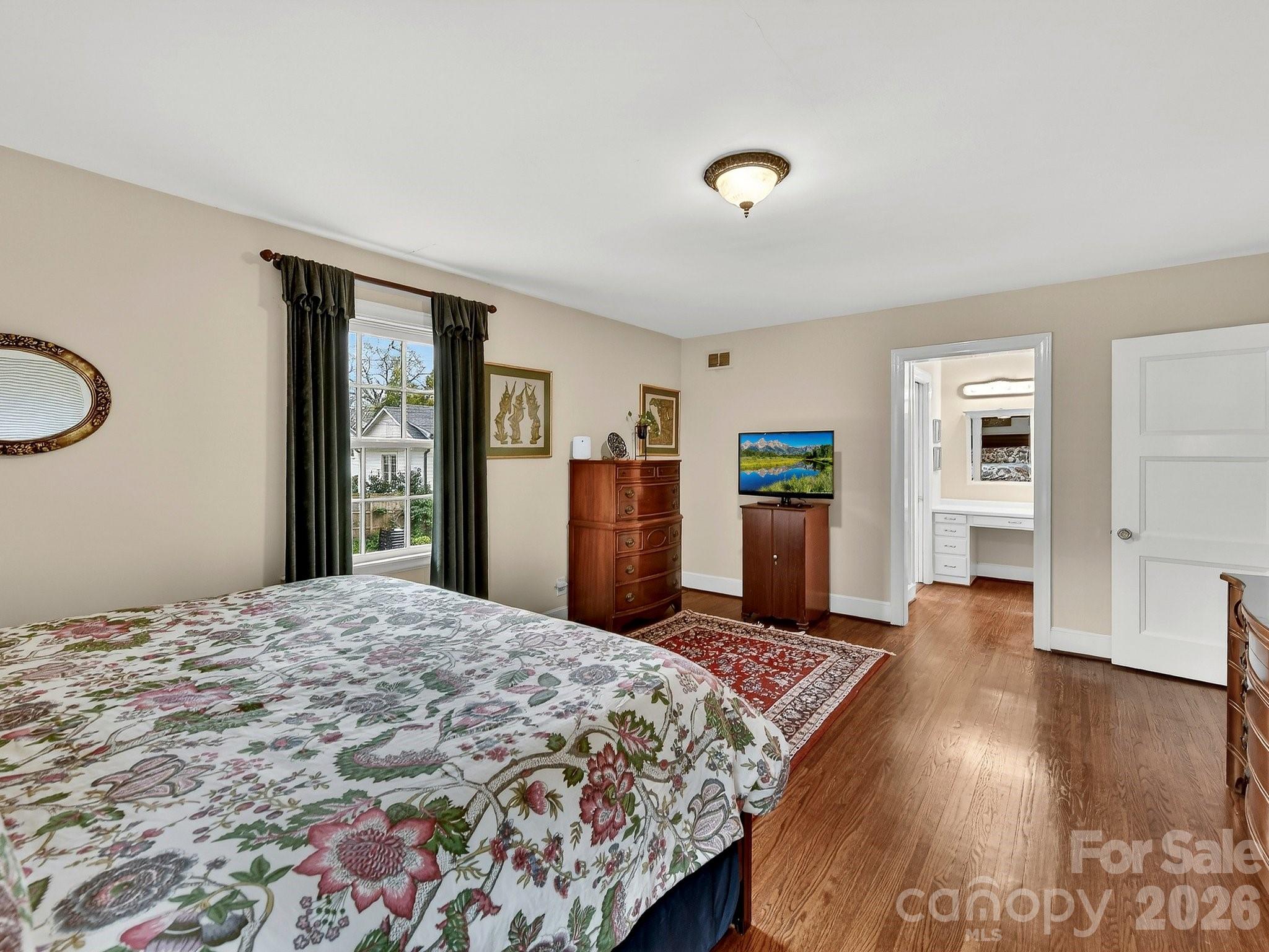 1535 Providence Road Charlotte, NC 28207 - Photo 32 of 42 a bedroom with a large bed and a dresser
