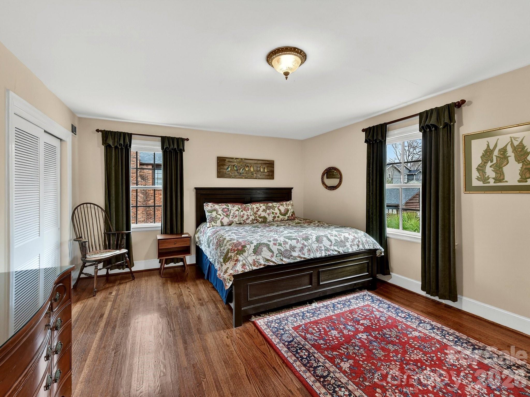 1535 Providence Road Charlotte, NC 28207 - Photo 33 of 42 a bed sitting in a bedroom next to a window