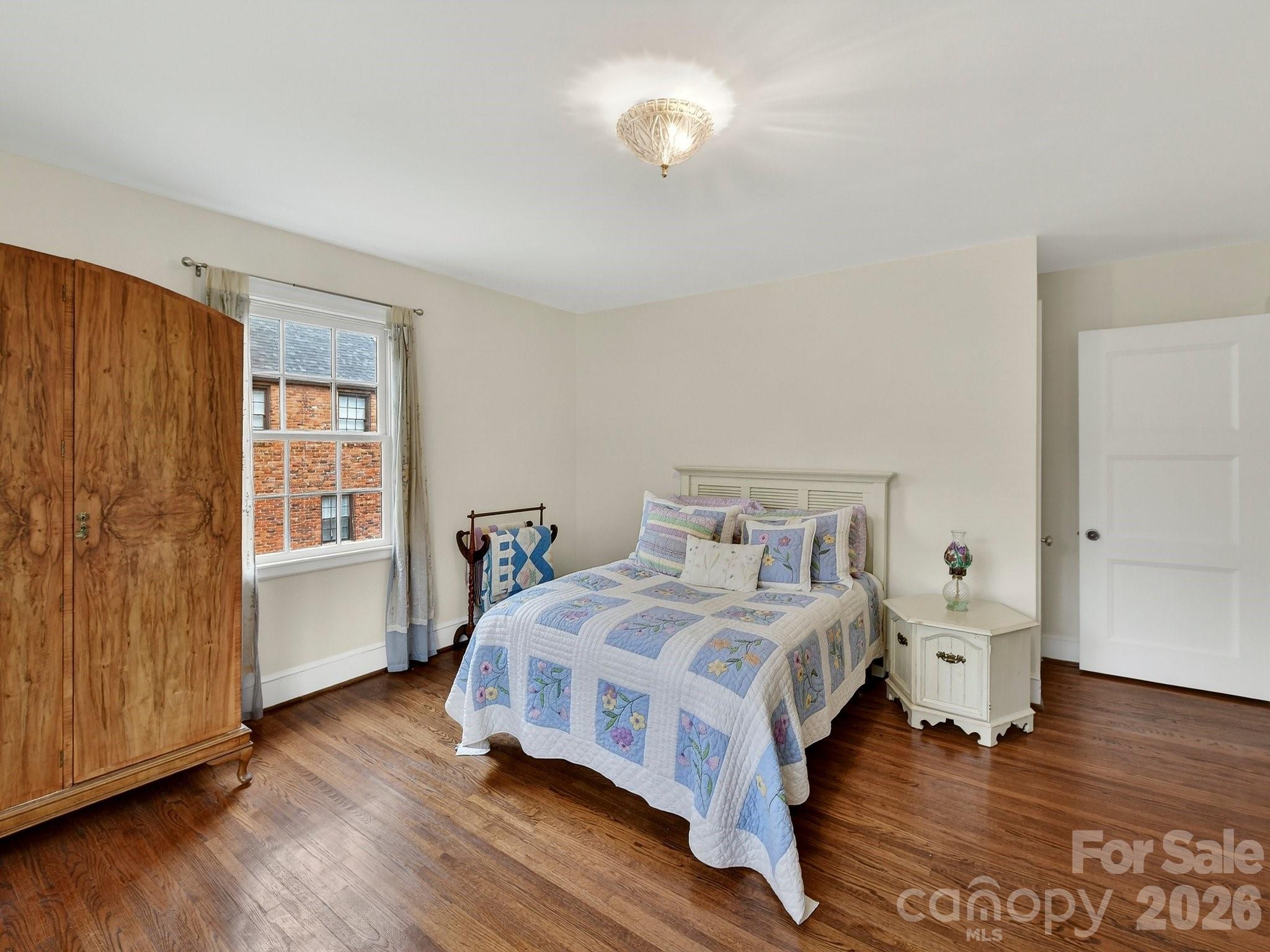 1535 Providence Road Charlotte, NC 28207 - Photo 37 of 42 a bedroom with a bed and a window