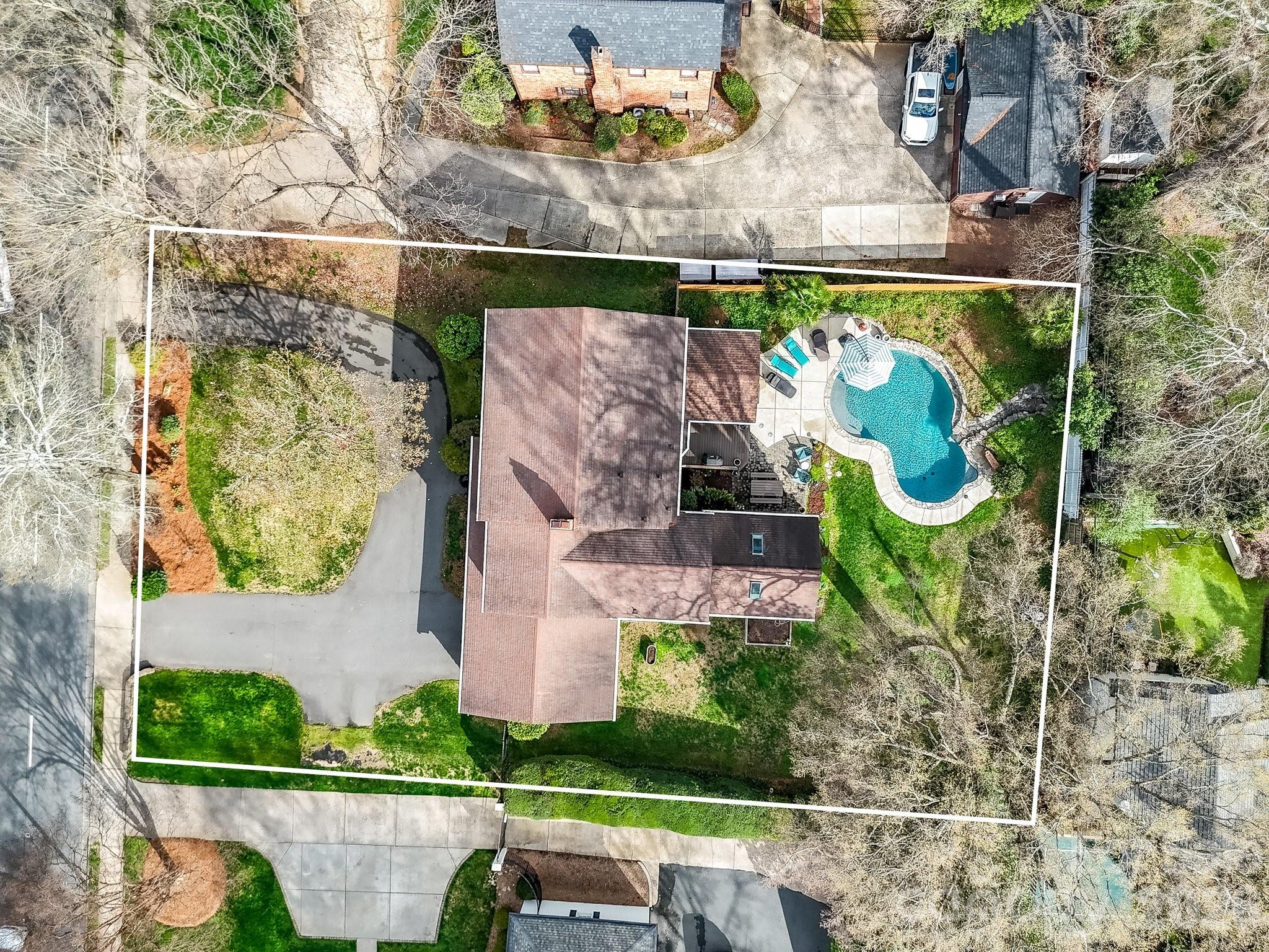 1535 Providence Road Charlotte, NC 28207 - Photo 39 of 42 an aerial view of a house with a garden and outdoor seating