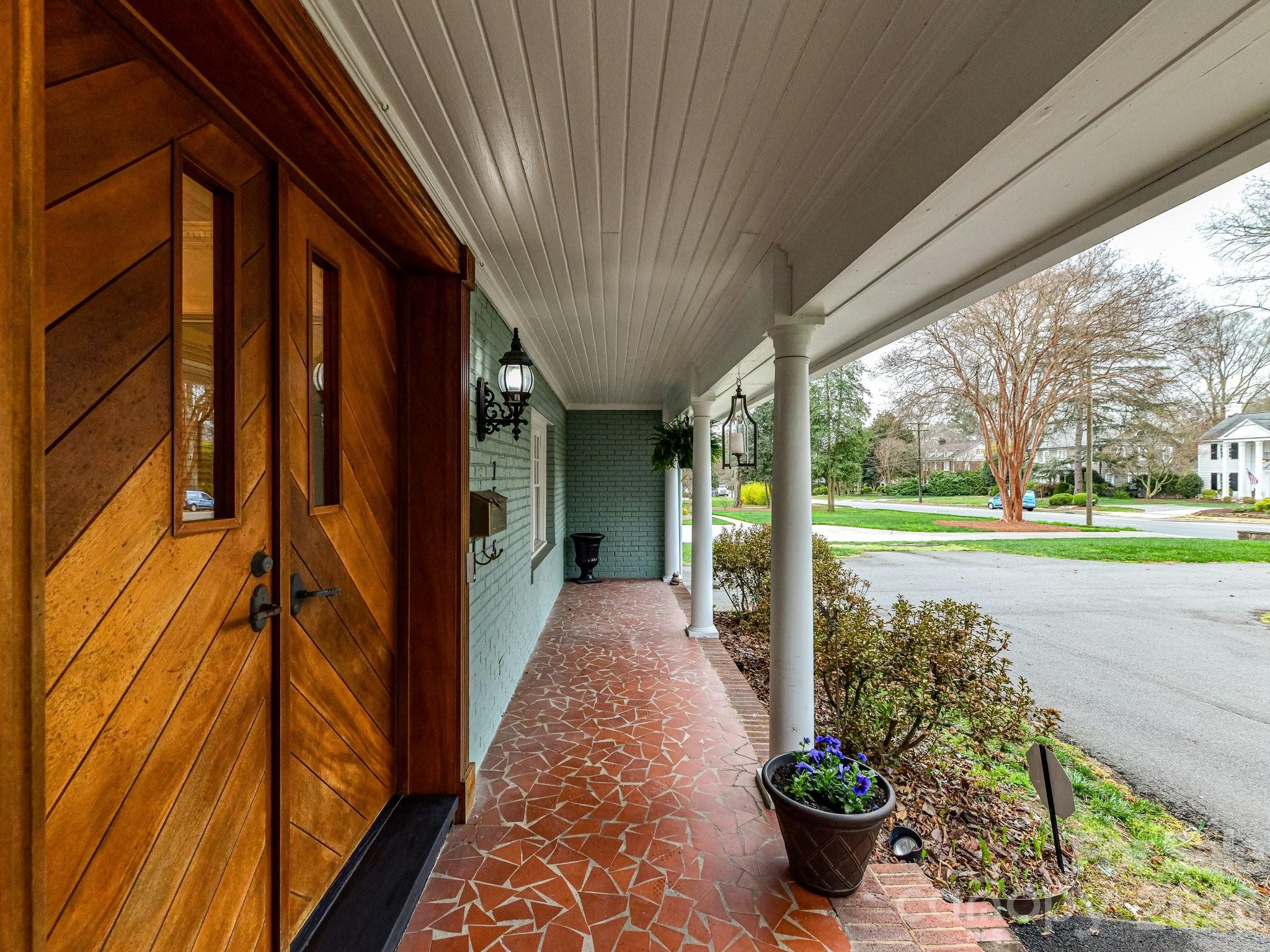 1535 Providence Road Charlotte, NC 28207 - Photo 4 of 42 a view of a porch with potted plants