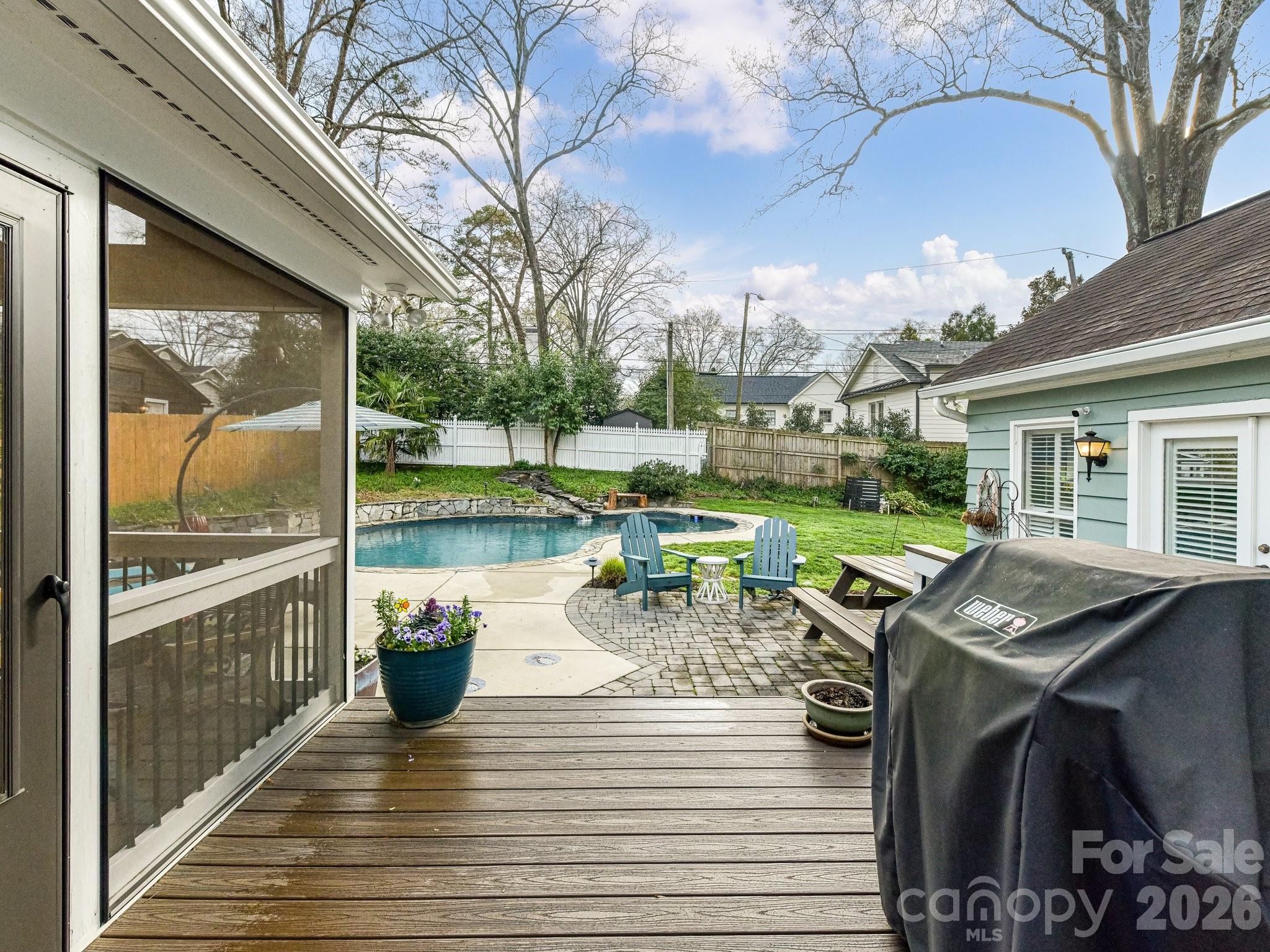1535 Providence Road Charlotte, NC 28207 - Photo 7 of 42 a view of a deck with table and chairs floor to ceiling with wooden floor