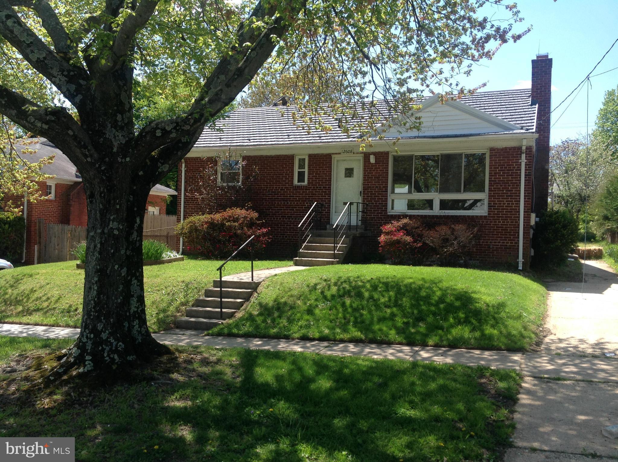 12608 Goodhill Road Silver Spring, MD 20906 - Photo 1 of 1 a front view of a house with garden and porch